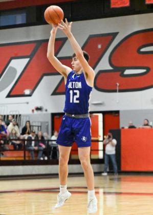 Olton’s Brady Azam fires up a three from the left elbow, during the first half of the Mustangs Area Championship victory over West Texas on Friday at Tascosa High School. (Staff Photo by Derek Lopez