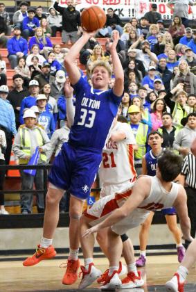 Olton’s Johnathan Cooper goes up strong for a lay-up, during the first half of the Mustangs Area Championship victory over West Texas on Friday at Tascosa High School. (Staff Photo by Derek Lopez