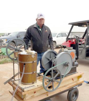 Gordon Graves is pictured with his Ice Cream Freezer at the annual Plow Day event held at the Graves farm on Saturday, March 23,2024. (Photo by Ann Reagan)
