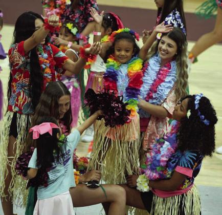 Campers work on their stunts, during Hawaii Day at Wildcat Cheer Camp that went on in June. (Staff Photo by Derek Lopez)