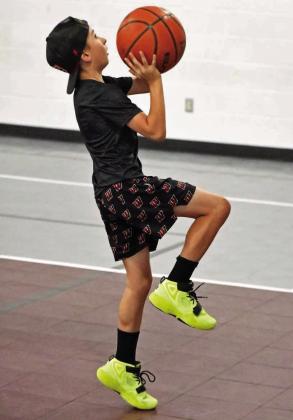 Campers work on lay-ups, during the Littlefield Basketball Camp that was held in June at the Elementary Gym. (Staff Photo by Derek Lopez)