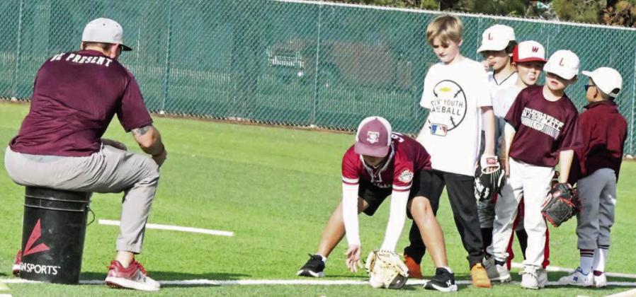 Campers worked on fielding and throwing skills at the Littlefield Baseball Camp that was held in June at Wildcat Field. (Staff Photo by Derek Lopez)