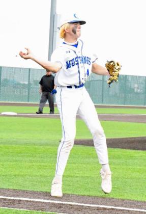 PLAYING THE BUNT - Olton senior pitcher, Brody Langford, fields a bunt on the first-base line and quickly tosses it to first for an out, during the Mustangs’, 15-5, game 2 Regional Quarterfinal loss to New Home on Thursday evening in Littlefield. (Staff Photo by Derek Lopez)