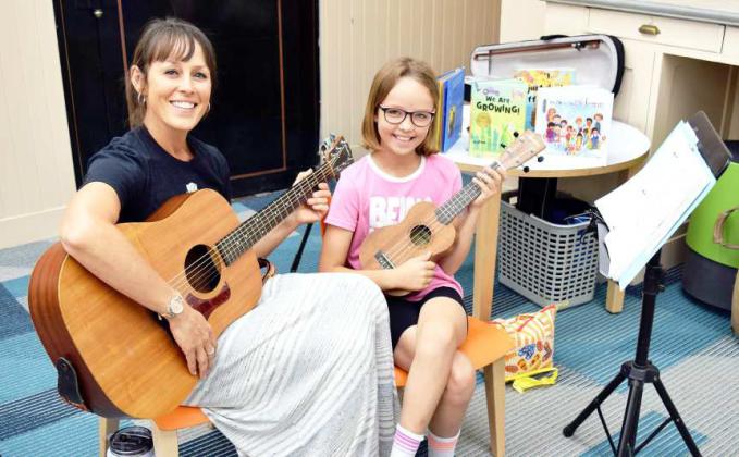 MS. TONI MEREDITH and her daughter entertained and educated through music at the Lamb County Library summer reading program on Wednesday, June 14, 2023. The theme for the program is “ All Together Now” featuring songs which dealt with Intergenerational and Disability Kindness. The lesson was that just because someone looks different it does not mean they are bad or scary. (Photo by Ann Reagan)