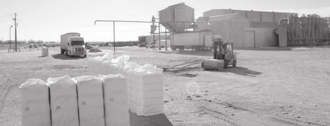 TEXAS PRODUCERS COOP GIN in Amherst was very busy on Saturday, Dec 4th getting cotton in and out in bales. There are still lots of modules in the back ground that are waiting to be ginned. (Staff Photo)