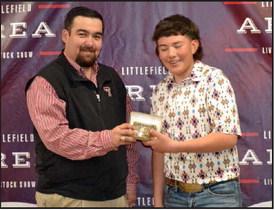 Jesus Macias of Littlefield 4-H won the Junior Showmanship Goat Award at the Littlefield Area Junior Livestock Show on Jan. 10, 2025 at the Lamb County Ag Center. Shown with Judge Cam Anderson. (Staff Photo by Grata Reber)