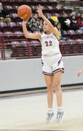 Littlefield senior, Jasmine Castillo, pulls up and buries a shot from the top of the key, during the Lady Cats’, 90-22, thrashing of Friona on Friday for senior night at Wildcat Gym. (Staff Photo by Derek Lopez)