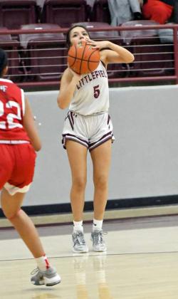 Littlefield senior, Jazmine Rosalez, drains a three from the right elbow, during the Lady Cats’, 90-22, thrashing of Friona on Friday for senior night at Wildcat Gym. (Staff Photo by Derek Lopez)