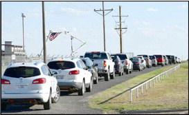 The line of vehicles on Wildcat Drive going to cast their votes at the LCEC annual meeting and vote held at Wildcat Stadium on Tuesday, September 19, 2023. According to the report given at the brief business meeting following the LCEC event, approximately 168 vehicles attended the LCEC event to cast their votes. (Photo by Ann Reagan)
