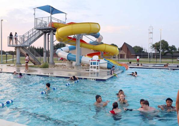 Pool-goers enjoy a relaxing afternoon in the pool during a free event at the Littlefield Aquatic Center on Monday sponsored by Wellpoint. Free food was also provided. (Photo byAnn Reagan)