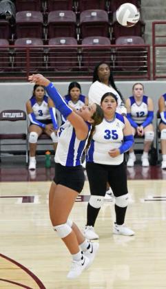 Olton’s Kambri Ruiz, sends a hit over the net to keep the play alive, during the first set of the Fillies’ Littlefield Tournament-opener on Thursday against Klondike at Wildcat Gym. (Staff Photo by Derek Lopez)