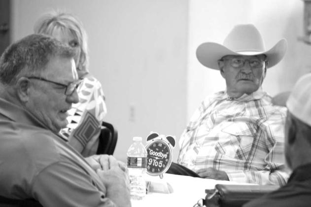 Retired Police Chief David Kinney talks with friends and family during his retirement party on June 30 at the Church of Christ in Anton, TX. (Photo by Leon Szaniszlo)