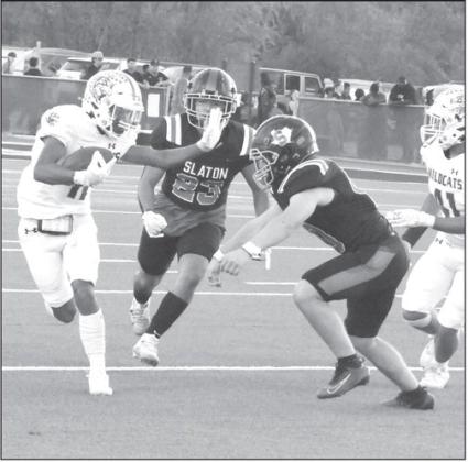 Littlefield’s Zane Champion takes the hand-off on the Starburst during the kick return, taking the ball up to the Littlefield 38-yard line, where the offense took over for their first drive. (Staff Photo by Derek Lopez)