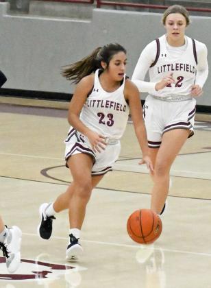 BRINGING THE BALL DOWN- Littlefield’s Arianna Cruz (23), brings the ball down court after a Hereford turnover, during the first half of the Lady Cats’, 47-42, victory over Herford on Tuesday at Wildcat Gymnasium. (Staff Photo by Derek Lopez)