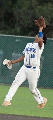 Olton’s Fabian Gutierrez catches a fly ball in shallow left field for the second out of the bottom of the fifth inning, during their, 9-0, Bidistrict loss to Ropes on Thursday in Littlefield. (Staff Photo by Derek Lopez)