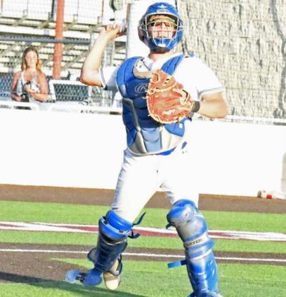 Olton catcher, Jaxon Tomsu picks up a dropped third strike and throws it to first for an out, during the bottom of the third inning of their, 90, Bi-district loss to Ropes on Thursday in Littlefield. (Staff Photo by Derek Lopez)