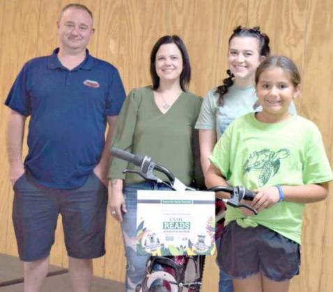 BICYCLE WINNER -- Kasey and Vanna Wright of Wright Collision Center, Victoria Dennis, and the first place prize winner ages 10-12 Kendall Vargas. (Photo by Ann Reagan)