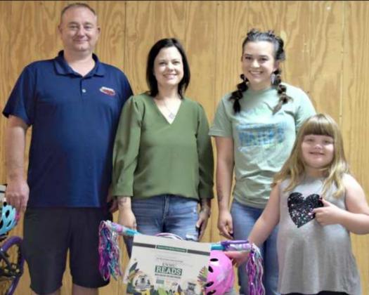 BICYCLE WINNER -- First place prize winner age 4 to 6 pictured with left to right Kasey and Vanna Wright of Wright Collision Center, Victoria Dennis, and Poppy Demel. (Photo by Ann Reagan)