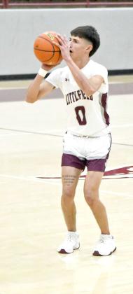 Omar Martinez fires up a three from the top of the key, during the first half of the Wildcat’s, 58-52, victory over Idalou in Littlefield on Tuesday. (Staff Photo by Derek Lopez)