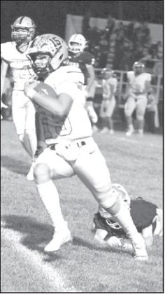 Sudan’s Caleb Groetken cuts it back across the field beating a defender for a 40-yard touchdown run, capping off the Hornets, 35-6, victory over Vega on the road Friday night. (Staff Photo by Derek Lopez)
