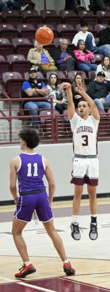 Littlefield’s Ryan Williams pulls up for a three from the right elbow for three of his career high 24 points, during the first half of their contest against Dimmitt on Tuesday at Wildcat Gym. (Staff Photo by Derek Lopez)