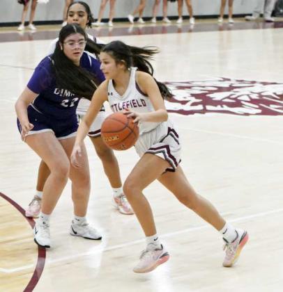 Littlefield’s Ari Castillo looks to blow by a Dimmitt Defender, during the first half of their contest against Dimmitt on Tuesday at Wildcat Gym. (Staff Photo by Derek Lopez)