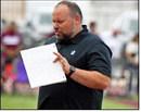 First Baptist Church Pastor Tanner Wilson, prays before the meal at Meet the Wildcats last Thursday at Wildcat Stadium. (Staff Photo by Derek Lopez)