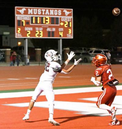 Littlefield’s Gabriel Villanueva (32), catches a touchdown pass from quarterback, Chip Green, during the fourth quarter of Littlefield’s, 35-14, victory over the Mustangs on Friday night. (Staff Photo by Derek Lopez)