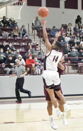 GETTING TO THE BASKET —Littlefield senior guard, Jeremiah Salazar (14), takes the ball strong to the hoop, during the first half of the Wildcats loss to the Antelopes on Friday at Wildcat Gym. (Staff Photo by Derek Lopez)