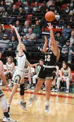 GOING BASELINE — Sudan sophomore, Braelyn Pointer (22), drives the right baseline and pulls up for a jumper on the wing, during the first half of the Nettes’ 2A Regional Quarterfinal victory over the Ropes Lady Eagles at Levelland High School on Thursday. (Staff Photo by Derek Lopez)