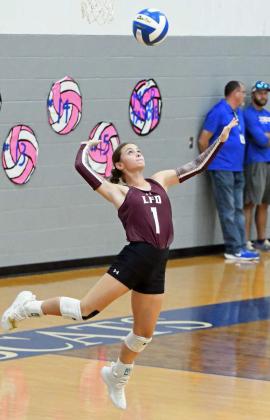 Littlefield’s Bryndle Ray delivers a serve, during the Lady Cats road district match-up with Childress on Tuesday. (Staff Photo by Derek Lopez)