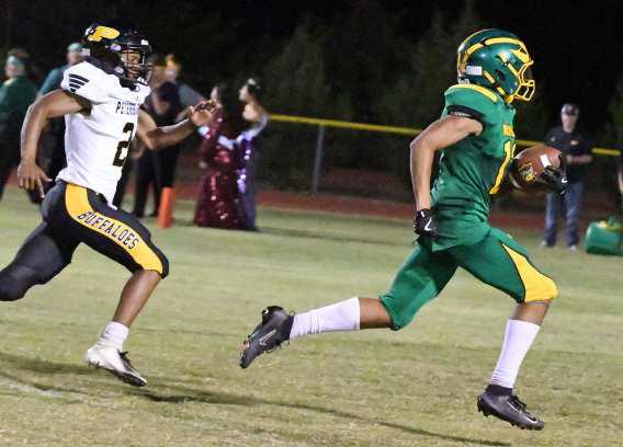 Springlake- Earth’s Kaylob Frietz, returns an interception for a touchdown to close out their game on Friday, as the Wolverines celebrated Homecoming with a, 74-26, victory over Petersburg at Wolverine Stadium. (Staff Photo by Derek Lopez)