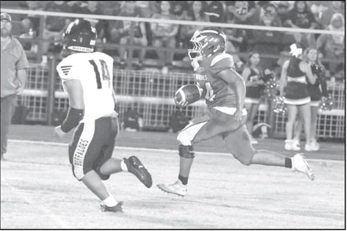 Springlake-Earth’s Bryan Longoria breaks loose for a 45-yard touchdown run, during the Wolverine’s Homecoming victory over Petersburg on Friday night. (Staff Photo by Derek Lopez)
