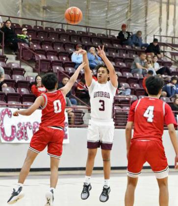 Littlefield senior, Ryan Williams, fires up a three from the top of the key, during the first half of the Wildcat’s home loss to Denver City on Saturday, 58-55, at Wildcat Gym. (Staff Photo by Derek Lopez)