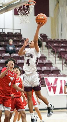 Littlefield senior, Kam McCarty, gets to the rim for a lay-up, during the first half of the Wildcat’s home loss to Denver City on Saturday, 58-55, at Wildcat Gym. (Staff Photo by Derek Lopez)