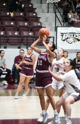 Littlefield senior, Amiah Elizondo goes up strong for a lay-up under the basket, during the Lady Cats, 56-32, victory on the road last Tuesday at Roosevelt. (Staff Photo by Derek Lopez)
