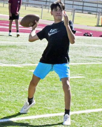 Campers at the 2025 Littlefield Youth Football Camp play a game of speedball before transitioning to offensive drills, during the second day of camp on Tuesday. (Staff Photo by Derek Lopez)