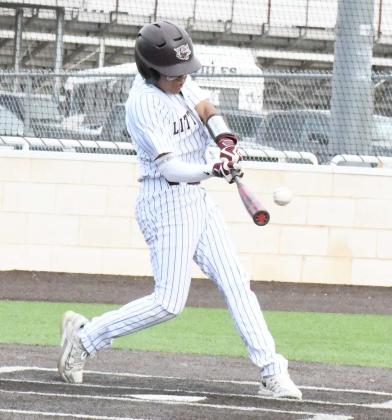 GETTING ON BASE - Littlefield’s Isaiah Rodriguez, rips a single over third base in the bottom of the fifth inning to give the Wildcats a bae runner, during their, 3-0, loss to the Bushland Falcons on Tuesday at Wildcat Field. (Staff Photo by Derek Lopez)