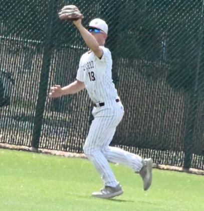 Littlefield center fielder, Bradyn Redman, catches a fly ball in shallow center field for an out, during the top of the seventh inning of the Wildcats, 6-3, victory over the Bobcats on Saturday in their first meeting of District Play. (Staff Photo by Derek Lopez)