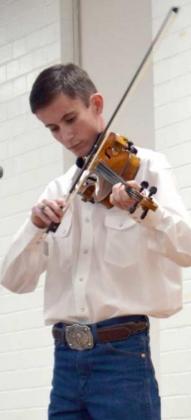 DECLAN LOWE entertained with two numbers on his violyn (Staff Photo by Joella Lovvorn)