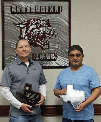 Littlefield Supt. Mitch McNeese presented Hervey Valdez and Johnny Castillo with plaques for their service to the Littlefield Independent School District. Castillo has served on the school board for nine years, while Valdez has served for eight years. (Staff Photo by Derek Lopez)