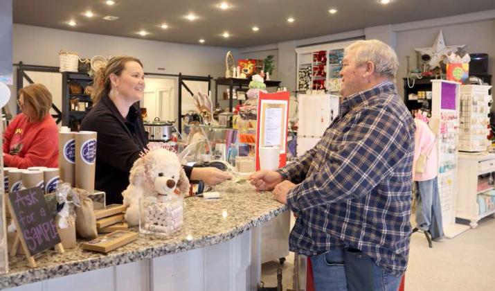 Shelly Lippold serves a 'Breakfast Club' patron Gregg McNabb on Tuesday, February 6, 2024 during Shelby's Bridge's 7th Anniversary celebration. (Photo by Ann Reagan)