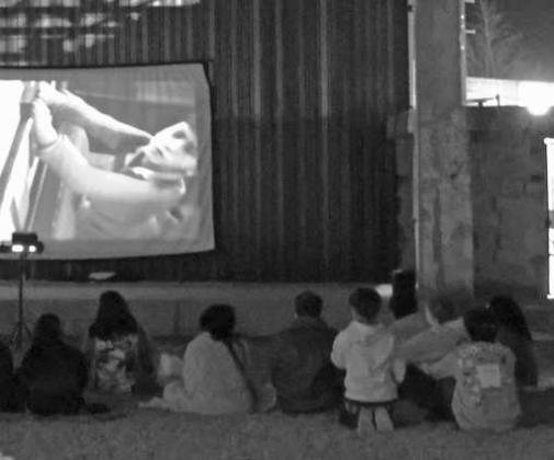Some chose to watch 'The Polar Express' playing at the Pocket Park in downtown Littlefield, Texas during the Christmas Bash held on Friday December 12, 2025. (Photo by Ann Reagan)