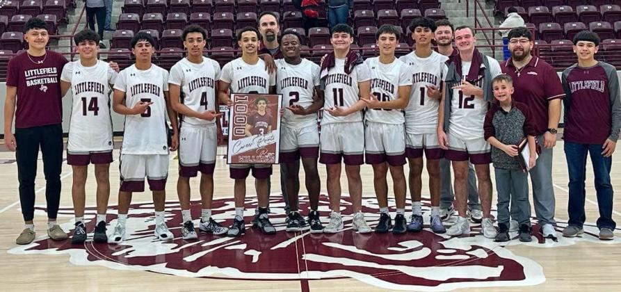 Littlefield senior guard, Ryan Williams, reached 1,000 career points in his high school career, as the Wildcats took down the Friona Chieftains on Tuesday to close out the regular season. Show is Williams with his teammates and coaches to celebrate his accomplshment after the game. (Submitted Photo)