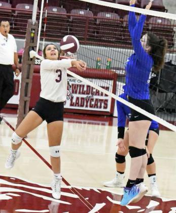 KEEPING THE PLAY ALIVE - Littlefield’s Bri Valdez (3), keeps a ball alive near the net, during the first set of the Lady Cats’, 2-0, victory over the Lubbock Titans on Tuesday morning at Wildcat Gym. (Staff Photo by Derek Lopez)