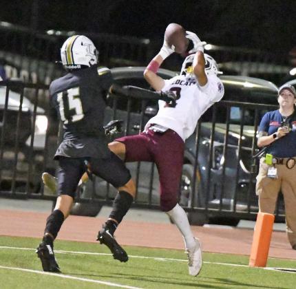 Littlefield’s Gabe Mata catches a 29-yard touchdown pass from Sammy Saenz to put the Wildcats up, 4227, with 2:48 to go in the third quarter of the Wildcats’, 49-47, victory at Lamesa on Friday. (Staff Photo by Derek Lopez)