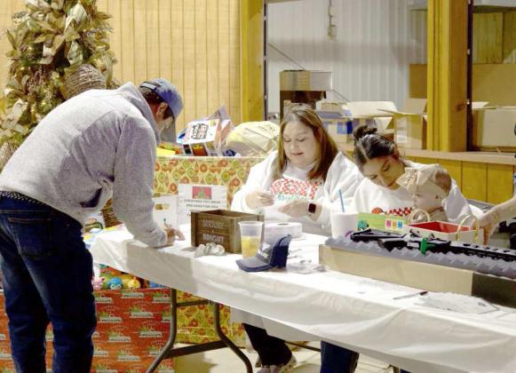 Attendees of the Valley Ag. Luncheon sign up for raffles held on Dec. 6, 2024 in Olton. (Staff Photo by Rhode Duenas)
