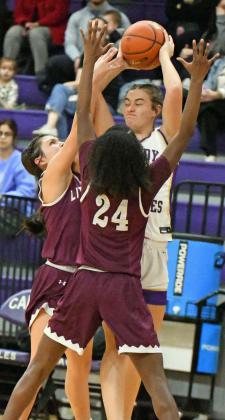 Littlefield’s Cali Saldana and Amoni Jefferson apply a trap defense in the corner forcing a turnover, during the first half of the Lady Cats’ Bi-district loss to Dalhart in Canyon on Monday. (Staff Photo by Derek Lopez)