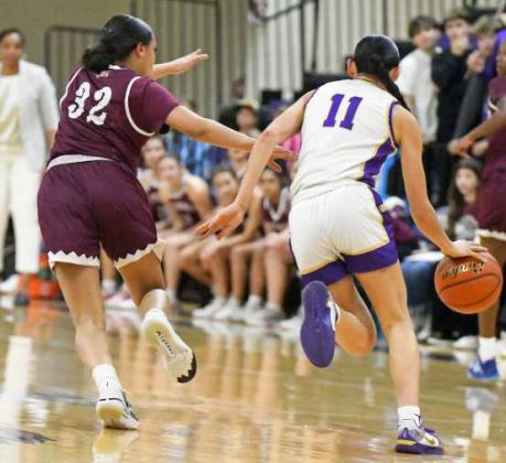 Littlefield’s Madison Williams (32) guards the ball, as Dalhart brings the ball down court during the first half of the Lady Cats’ Bi-district loss to Dalhart in Canyon on Monday. (Staff Photo by Derek Lopez)