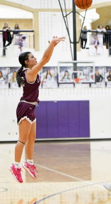 Littlefield’s Cali Saldana drains a three from the right elbow, during the first half of the Lady Cats’ Bi-district loss to Dalhart in Canyon on Monday. (Staff Photo by Derek Lopez)